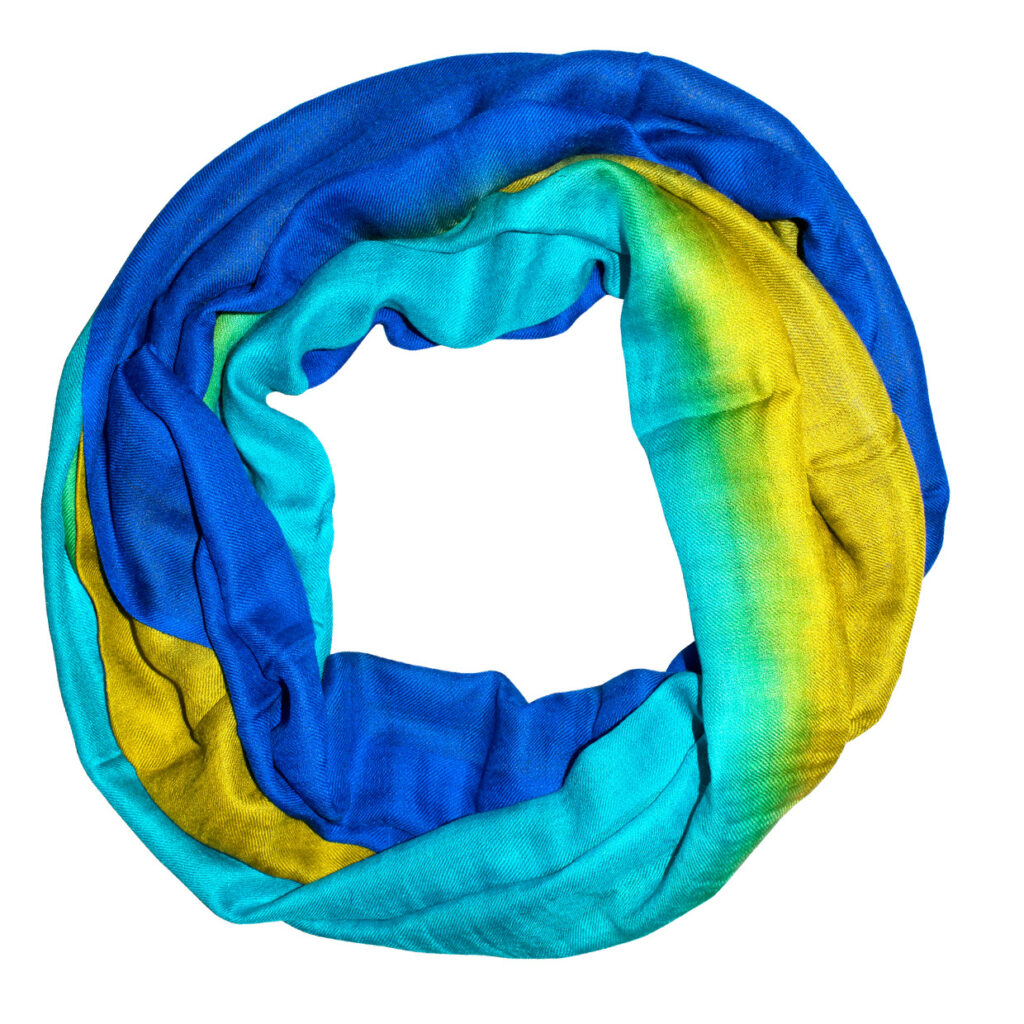 An hombre scarf in blues and yellows, representing an extensive collection of scarves in numerous colors and prints.