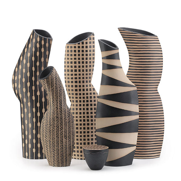 A collection of handmade vases with various black and brown patterns. Representing an extensive vase collection.