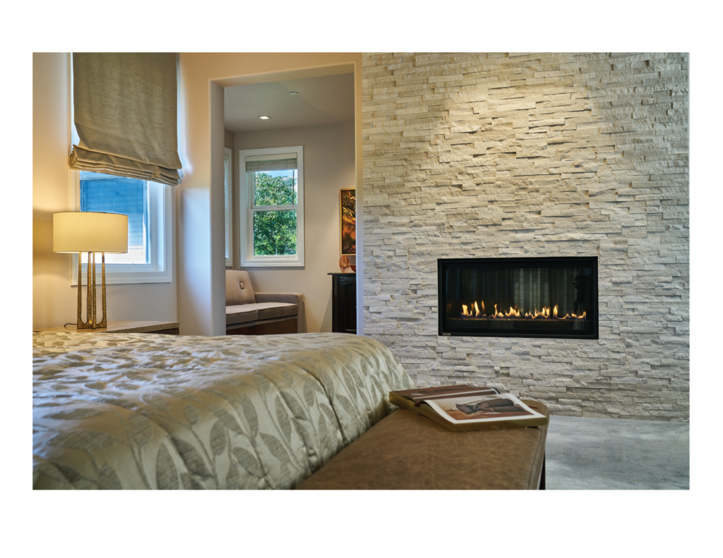 Luxury interior design for a home in Tiburon, California, in the San Francisco Bay Area, including custom designed and upholstered furniture by Ruth Livingston Designs. 

The bedroom includes luxury bedding, a fireplace with custom crafted stonework on the exterior.
